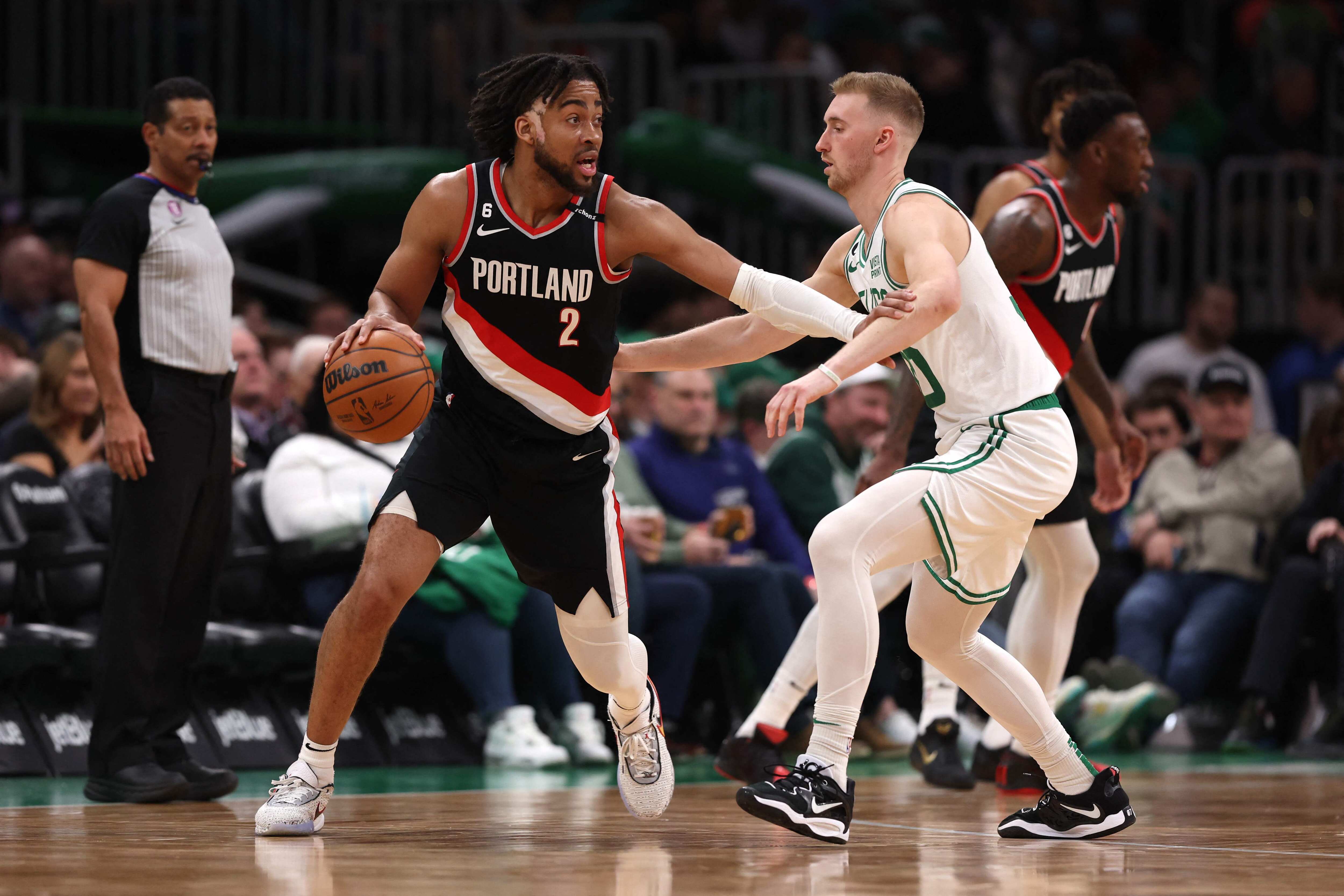 Trendon Watford #2 of the Portland Trail Blazers dribbles against Sam Hauser #30 of the Boston Celtics at TD Garden on March 08, 2023 in Boston, Massachusetts. The Celtics defeat the Trail Blazers 115-93. (Getty Images via AFP) Trendon Watford #2 of the Portland Trail Blazers dribbles against Sam Hauser #30 of the Boston Celtics at TD Garden on March 08, 2023 in Boston, Massachusetts. The Celtics defeat the Trail Blazers 115-93. (Getty Images via AFP)
