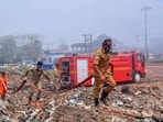 Fire and rescue personnel at Brahmapuram waste treatment plant, in Kochi. (PTI) Fire and rescue personnel at Brahmapuram waste treatment plant, in Kochi. (PTI)