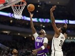 Bobby Portis #9 of the Milwaukee Bucks drives to the basket against Day'Ron Sharpe #20 of the Brooklyn Nets during the first half of a game at Fiserv Forum on March 09, 2023 in Milwaukee, Wisconsin. Bobby Portis #9 of the Milwaukee Bucks drives to the basket against Day'Ron Sharpe #20 of the Brooklyn Nets during the first half of a game at Fiserv Forum on March 09, 2023 in Milwaukee, Wisconsin.