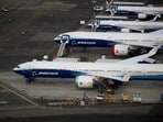 Boeing 777X and Boeing 737 MAX 10 airplanes are seen parked in an aerial view.