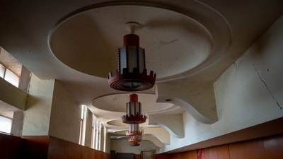 An unrenovated section of Uma Mandir holds all its original textures and colours, including beautiful teakwood-and-glass chandeliers, vintage yellow mosaic floors, teakwood bannisters, and pillars of solid granite and marble.&nbsp; (Hemant Chaturvedi)