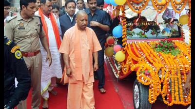 Chief minister Yogi Adityanath during the flag-off of the battery-operated vehicle service for devotees to the Vindhyavasini temple, in Mirzapur on Friday. (ANI Photo)