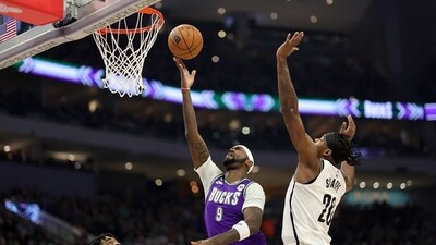 Bobby Portis #9 of the Milwaukee Bucks drives to the basket against Day'Ron Sharpe #20 of the Brooklyn Nets during the first half of a game at Fiserv Forum on March 09, 2023 in Milwaukee, Wisconsin. (Getty Images via AFP)