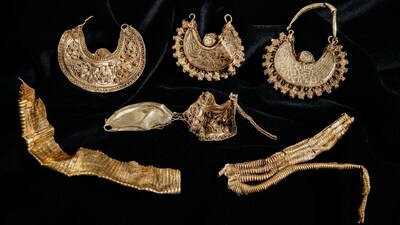 Part of the 1000-year-old medieval treasure discovered in Hoogwoud, Netherlands, consisting of jewellery and silver coins, is shown in this undated handout picture. (via REUTERS)