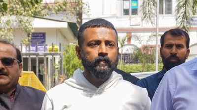 Alleged conman Sukesh Chandrashekhar at Patiala House court for appearing in connection with a money laundering case, in Delhi, Feb. 24, 2023. (PTI Photo) (PTI) Alleged conman Sukesh Chandrashekhar at Patiala House court for appearing in connection with a money laundering case, in Delhi, Feb. 24, 2023. (PTI Photo) (PTI)