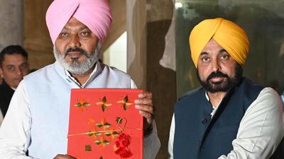 Punjab chief minister Bhagwant Mann along with finance minister Harpal Cheema with the budget document at the Vidhan Sabha in Chandigarh on Friday. With no new taxes and 26% hike in allocation over last year, Punjab budget focuses on agriculture, education, health . (Ravi Kumar/HT ) Punjab chief minister Bhagwant Mann along with finance minister Harpal Cheema with the budget document at the Vidhan Sabha in Chandigarh on Friday. With no new taxes and 26% hike in allocation over last year, Punjab budget focuses on agriculture, education, health . (Ravi Kumar/HT )