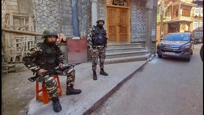 Security personnel during a raid at the residence of Hurriyat leader Qazi Yasir in Anantnag district on Thursday. (PTI)
