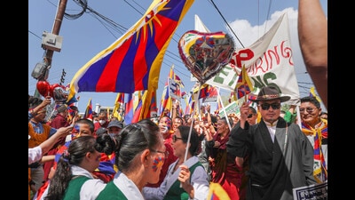 Tibetans-in-exile take out a peace march on the 64th Tibetan National Uprising Day at McLeodganj on Friday. (PTI) Tibetans-in-exile take out a peace march on the 64th Tibetan National Uprising Day at McLeodganj on Friday. (PTI)