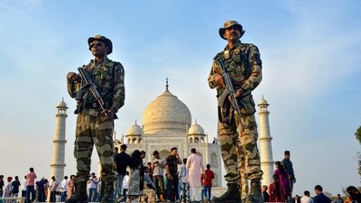 CISF jawans guard at the Taj Mahal, in Agra, Thursday. (PTI)