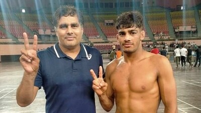 Anuj Kumar with coach Ajay Dhanda after winning 65kg selection trials (HT Photo) Anuj Kumar with coach Ajay Dhanda after winning 65kg selection trials (HT Photo)
