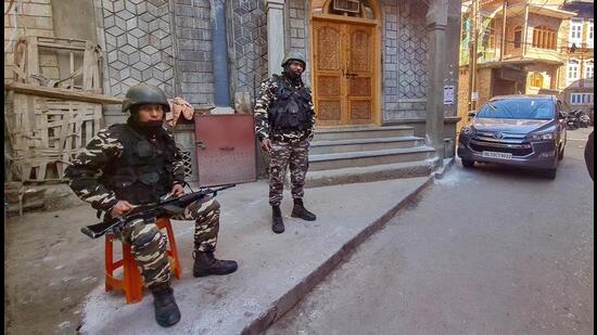 Security personnel during a raid at the residence of Hurriyat leader Qazi Yasir in Anantnag district on Thursday. (PTI)