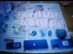 Picture showing seized drugs, mobiles, and other possessions. Picture showing seized drugs, mobiles, and other possessions.