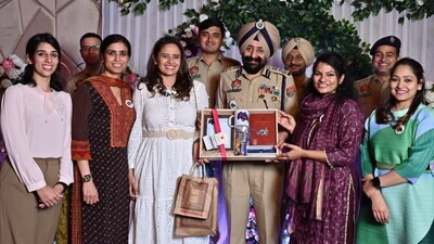 Ludhiana police commissioner Mandeep Singh Sidhu honouring women officers during the International Women's Day celebration on Saturday. (HT Photo)