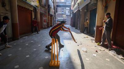 Youngsters play cricket in a street during the Jammu bandh on Saturday. (PTI) Youngsters play cricket in a street during the Jammu bandh on Saturday. (PTI)
