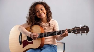 Use games and activities: Kids love games and activities, so try to incorporate these into their guitar lessons. For example, you could use flashcards to help them learn chords or create a game where they have to identify notes on the fretboard. (Unsplash) Use games and activities: Kids love games and activities, so try to incorporate these into their guitar lessons. For example, you could use flashcards to help them learn chords or create a game where they have to identify notes on the fretboard. (Unsplash)