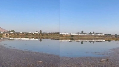 Vande Bharat train passes through a picturesque location. (Twitter/@mansukhmandviya) Vande Bharat train passes through a picturesque location. (Twitter/@mansukhmandviya)