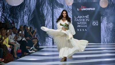 Neha Dhupia as the showstopper for INIFD Launchpad at Lakme Fashion Week in Partnership with FDCI. Neha Dhupia as the showstopper for INIFD Launchpad at Lakme Fashion Week in Partnership with FDCI.