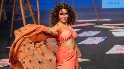 Sanya Malhotra in a an orange look as the showstopper for Flirtatious India. Sanya Malhotra in a an orange look as the showstopper for Flirtatious India.