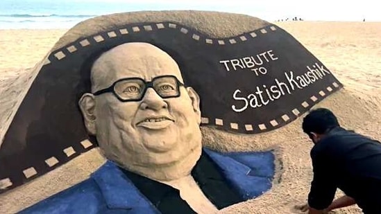 Sand artist Sudarsan Pattnaik creates a sand art of Bollywood actor-director Satish Chandra Kaushik as a tribute to him, in Puri on Thursday. (ANI)