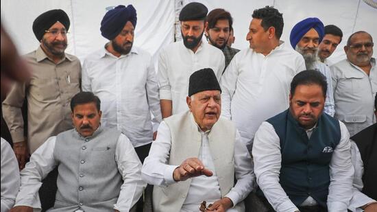 National Conference president Farooq Abdullah (centre) with leaders of various political parties addressing the media at his residence in Jammu on Saturday. (PTI)