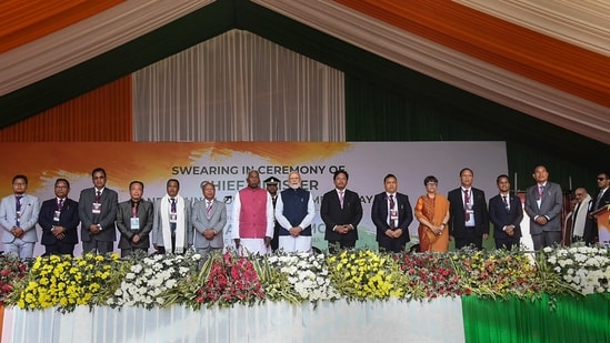Prime Minister Narendra Modi with Meghalaya Governor Phagu Chauhan and newly sworn-in Chief Minister Conrad Sangma and Ministers of Meghalaya, at a ceremony in Shillong, Tuesday. (PTI)