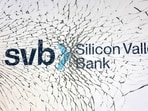 SVB (Silicon Valley Bank) logo is seen through broken glass in this illustration.