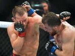 Mar 11, 2023; Las Vegas, Nevada, USA; Petr Yan (red gloves) fights Merab Dvalshvili (blue gloves) during UFC Fight Night at Virgin Hotel. Mandatory Credit: Ron Chenoy-USA TODAY Sports