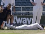South Africa's bowler Keshav Maharaj on the lies on the ground after twisting his left foot while celebrating his second wicket South Africa's bowler Keshav Maharaj on the lies on the ground after twisting his left foot while celebrating his second wicket