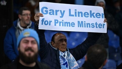 A Manchester City fan holds a banner reading "Gary Lineker for Prime Minister" ahead of the English Premier League football match between Crystal Palace and Manchester City at Selhurst Park in south London on Saturday, (AFP) A Manchester City fan holds a banner reading "Gary Lineker for Prime Minister" ahead of the English Premier League football match between Crystal Palace and Manchester City at Selhurst Park in south London on Saturday, (AFP)