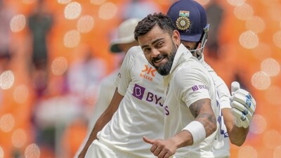 Virat Kohli gestures as he celebrates after scoring a century (AP) Virat Kohli gestures as he celebrates after scoring a century (AP)