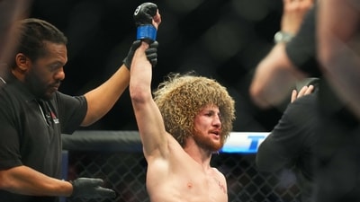 Merab Dvalshvili (blue gloves) reacts after fighting Petr Yan (red gloves) during UFC Fight Night at Virgin Hotel. (USA TODAY Sports)