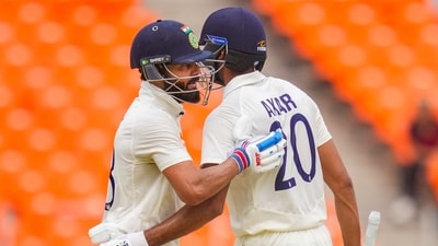 Virat Kohli (L) with Axar Patel (PTI)