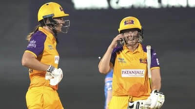 UP Warriorz players Alyssa Healy and Tahlia McGrath celebrate thier half century and partnership against Mumbai Indians (PTI)