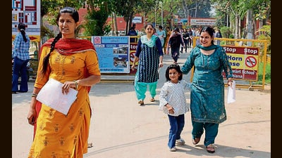 Participants coming out from the exam centre after appearing in Punjab State teacher eligibility test in Ludhiana on Sunday. ((Photo by Gurpreet Singh/Hindustan Times)) Participants coming out from the exam centre after appearing in Punjab State teacher eligibility test in Ludhiana on Sunday. ((Photo by Gurpreet Singh/Hindustan Times))