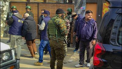 Security officials at Budgam, where pieces of the woman’s body were recovered, on Sunday. (PTI) Security officials at Budgam, where pieces of the woman’s body were recovered, on Sunday. (PTI)