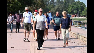 Tourists taking a stroll at Sukhna Lake in Chandigarh. (Keshav Singh/HT)