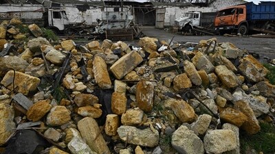 Russia-Ukraine War: Damaged trucks amid debris at a grain storage facility destroyed following missile attack. (AFP)