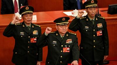 Zhang Youxia (centre), newly-elected vice-chairman of the Central Military Commission (CMC) of China, swears an oath with Cmc members He Weidong and Li Shangfu after they were elected during the fourth plenary session of the National People’s Congress at the Great Hall of the People in Beijing on Saturday. (REUTERS) Zhang Youxia (centre), newly-elected vice-chairman of the Central Military Commission (CMC) of China, swears an oath with Cmc members He Weidong and Li Shangfu after they were elected during the fourth plenary session of the National People’s Congress at the Great Hall of the People in Beijing on Saturday. (REUTERS)