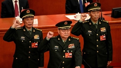 Zhang Youxia (C), vice chairman of the Central Military Commission of the People's Republic of China, swears an oath with Central Military Commission members He Weidong and Li Shangfu after they were elected during the fourth plenary session of the National People's Congress (NPC) in Beijing on Saturday. (via REUTERS)