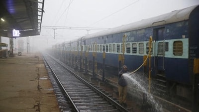 A worker cleans tracks at Lucknow railway station. (AP Photo) A worker cleans tracks at Lucknow railway station. (AP Photo)