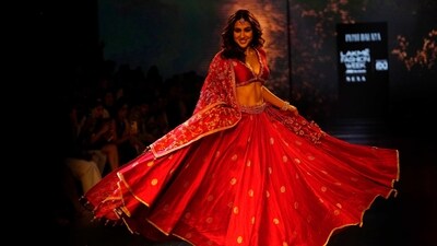 Sara Ali Khan turned showstopper for Punit Balana at Lakme Fashion Week. She wore a red lehenga. Sara Ali Khan turned showstopper for Punit Balana at Lakme Fashion Week. She wore a red lehenga. 