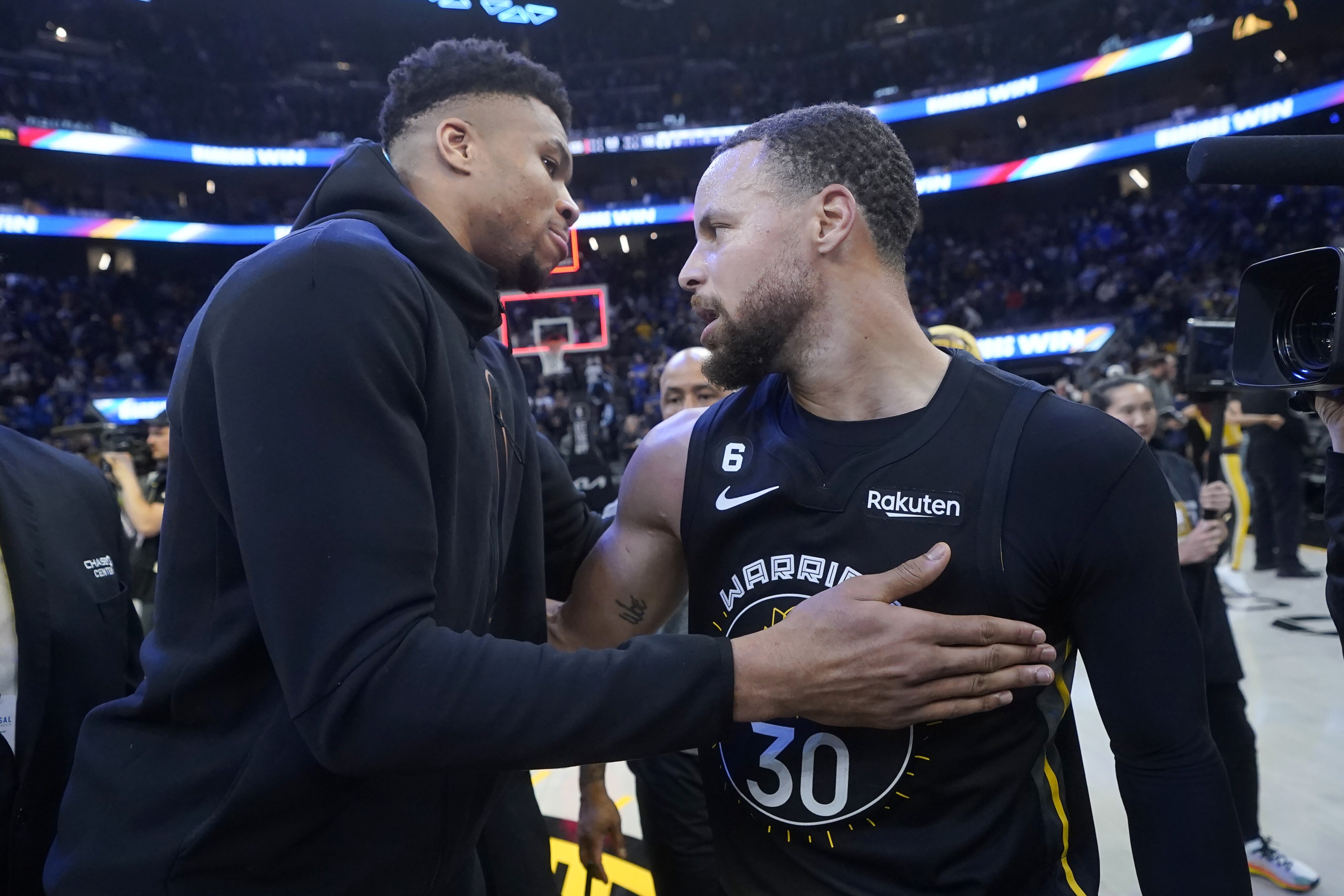 Milwaukee Bucks forward Giannis Antetokounmpo, left, greets Golden State Warriors guard Stephen Curry after the Warriors defeated the Bucks in overtime of an NBA basketball game in San Francisco, (AP) Milwaukee Bucks forward Giannis Antetokounmpo, left, greets Golden State Warriors guard Stephen Curry after the Warriors defeated the Bucks in overtime of an NBA basketball game in San Francisco, (AP)