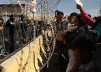Migrants, mostly of Venezuelan origin, attempt to forcibly cross into the United States at the Paso del Norte International Bridge in Ciudad Juarez, Chihuahua state, Mexico. (AP) Migrants, mostly of Venezuelan origin, attempt to forcibly cross into the United States at the Paso del Norte International Bridge in Ciudad Juarez, Chihuahua state, Mexico. (AP)
