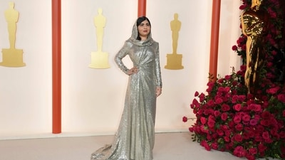 Malala Yousafzai turned heads in a sequin-covered hooded gown by Ralph Lauren Collection that fulfilled her own preferences and personal style while stepping up on the sparkle. The activist, author and Nobel Laureate paired her ensemble with jewellery from Fred Leighton that was previously owned by Queen Soraya Tarzi of Afghanistan - a legendary activist herself during the 20th century. (Photo by Jordan Strauss/Invision/AP) Malala Yousafzai turned heads in a sequin-covered hooded gown by Ralph Lauren Collection that fulfilled her own preferences and personal style while stepping up on the sparkle. The activist, author and Nobel Laureate paired her ensemble with jewellery from Fred Leighton that was previously owned by Queen Soraya Tarzi of Afghanistan - a legendary activist herself during the 20th century. (Photo by Jordan Strauss/Invision/AP)