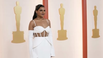 Mindy Kaling did not serve something of a statement in a structural spaghetti-strap gown with a questionable boning over an illusion bodice along with those flaps at the waist and long bell sleeves. The ensemble was by famed wedding-gown designer Vera Wang. (Ashley Landis/Invision/AP) Mindy Kaling did not serve something of a statement in a structural spaghetti-strap gown with a questionable boning over an illusion bodice along with those flaps at the waist and long bell sleeves. The ensemble was by famed wedding-gown designer Vera Wang. (Ashley Landis/Invision/AP)