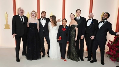 The team from Triangle of Sadness at the Oscars on Sunday, March 12, 2023, at the Dolby Theatre in Los Angeles. The team laughed and gave different poses for the camera. (AP) (Jordan Strauss/Invision/AP) The team from Triangle of Sadness at the Oscars on Sunday, March 12, 2023, at the Dolby Theatre in Los Angeles. The team laughed and gave different poses for the camera. (AP) (Jordan Strauss/Invision/AP)