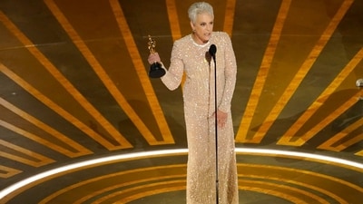 Jamie Lee Curtis, who won the Oscar in the best performance by an actress in a supporting role category for Everything Everywhere All at Once wore a glittering nude Dolce and Gabbana gown with long sleeves and boning on the bodice. (Chris Pizzello/Invision/AP) Jamie Lee Curtis, who won the Oscar in the best performance by an actress in a supporting role category for Everything Everywhere All at Once wore a glittering nude Dolce and Gabbana gown with long sleeves and boning on the bodice. (Chris Pizzello/Invision/AP)
