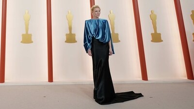 Cate Blanchett attended the Academy Awards ceremony in a dual-toned metallic blue and black Louis Vuitton gown. It comes with structured shoulders, a train on the back, and a free-flowing silhouette. (Ashley Landis/Invision/AP) Cate Blanchett attended the Academy Awards ceremony in a dual-toned metallic blue and black Louis Vuitton gown. It comes with structured shoulders, a train on the back, and a free-flowing silhouette. (Ashley Landis/Invision/AP)