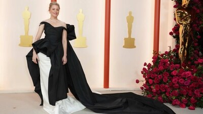 Elizabeth Banks makes a monochrome statement in a black-and-white gown featuring a long train and statement bow additions. (Jordan Strauss/Invision/AP) Elizabeth Banks makes a monochrome statement in a black-and-white gown featuring a long train and statement bow additions. (Jordan Strauss/Invision/AP)