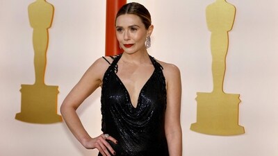 Elizabeth Olsen walked the 2023 Oscars red carpet in a shimmering black Givenchy gown that delivered a masterclass in understated brilliance.&nbsp; (REUTERS)